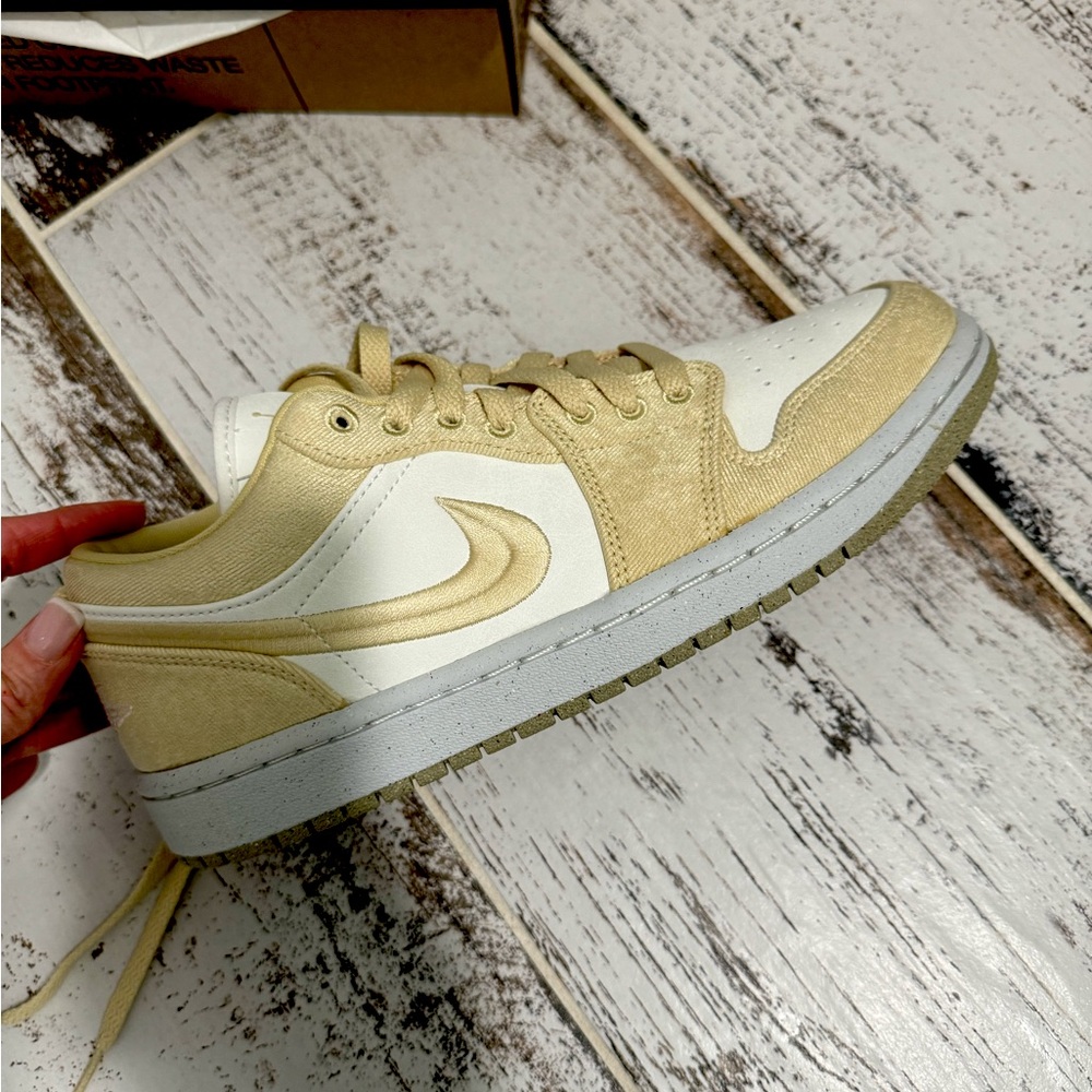 Brand New in box. Air Jordan 1 low women’s SE in Team Gold and Sail